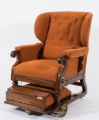 A 19th Century mahogany and upholstered patent adjustable wing armchair:, in brown moquette fabric,