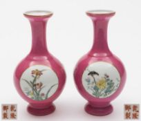 A pair of Chinese pink ground medallion vases: of baluster form with slender necks,