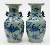 A pair of Chinese celadon ground baluster vases: with dragon handles,