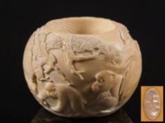 A Japanese carved ivory candle holder: of circular form,