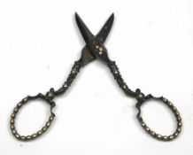 A pair of 19th century Tulaware scissors: 9cm. long.