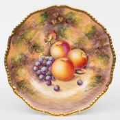 A Royal Worcester porcelain plate: of 'silver' shape with solid gilt gadrooned rim,