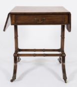 A Regency mahogany sofa table:, of small size, the hinged top with rounded corners,