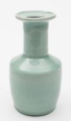 A Chinese celadon glazed vase: of mallet shaped form with flared rim, 17 cm high.