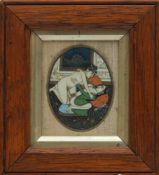 A Persian oval erotic miniature: of lovers in an interior setting, framed and glazed,
