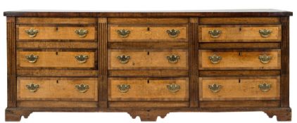 A George III oak and mahogany crossbanded rectangular dresser base:,