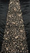 WITHDRAWN FS31 A late 19th/early 20th century raised bullion work dress panel: of triangular