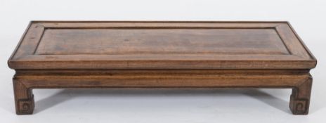 A Chinese hardwood rectangular opium table:, the top with a moulded edge, on square section legs,