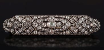 An early 20th century gold and diamond rectangular plaque brooch: of pierced design,
