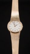 A lady's 9ct gold quartz 'Omega' wristwatch: the oval dial with baton markers and on 9ct gold,