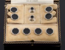 A suite of early 20th century 18ct white gold, black onyx and diamond cuff-links,