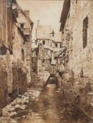 G Nicholson [19/20th Century]- Stone cottages and a stream in a town:- signed and dated