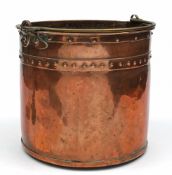 A 19th century copper log bin: of cylindrical form, with brass loop carrying handle, 50cm. high.