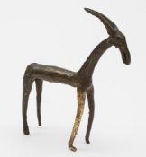 A small bronze figure of an antelope: standing four-square, 13 cm high.
