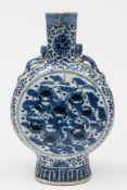 A large Chinese porcelain moon flask: of flattened form with Chilong handles,