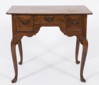 A mid 18th Century oak rectangular lowboy:, the top with rounded corners,