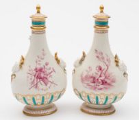 A pair of Minton porcelain scent flasks: of footed and flattened pear-shaped form with fluted basal