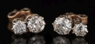 A pair of diamond two-stone earrings: with round old brilliant-cut diamonds estimated to weigh a
