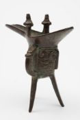 A Chinese bronze tripod ritual wine vessel,