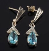 A pair of aquamarine and diamond drop earrings: each with a single pear-shaped aquamarine drop
