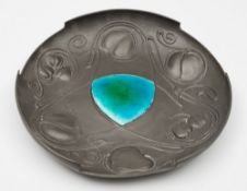 A Liberty and Co Art Nouveau period pewter dish: of circular outline with stylised trailing foliage