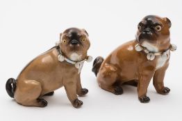 Two Continental porcelain pugs modelled after J.J.
