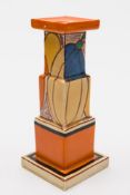 A Clarice Cliff pottery candlestick in the Melon (Picasso Fruit) pattern: of stepped square profile