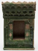 A Chinese green glazed pottery model of a shrine: with an arched niche and panelled doors to either