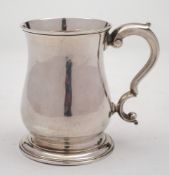 A George III silver mug, maker Fuller White, London, 1761: of plain baluster form,