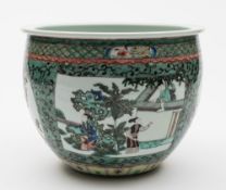 A Chinese porcelain jardiniere: of circular form enamelled in the famille verte palette with
