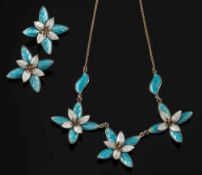 A Norwegian enamelled silver necklace and matching ear-clips: each with flower heads of white and