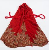 A Kashmir wool cape: the tomato red ground with silk embroidered fringe of flowers and boteh