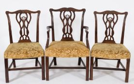 A set of six carved mahogany dining chairs in the Chippendale taste:,