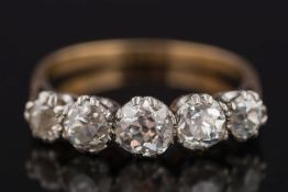 A gold and diamond five-stone half-hoop ring: with graduated round old brilliant-cut diamonds (one