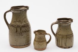 Richard Batterham (born 1936) a graduated garniture of three stoneware jugs: of tapering form with