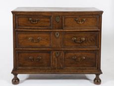 An early 18th Century oak, elm and ash rectangular chest:, of small size,