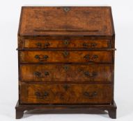 An early 18th Century (and later) burr walnut veneer and cross and feather banded bureau:,