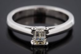 An 18ct white gold and 'Millennium' - cut diamond single-stone ring: with rectangular diamond