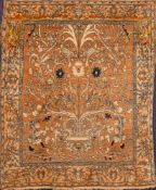 A Tabriz rug:, the light brown field with an all over design of flowering foliate stems,