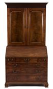 A George III mahogany bureau cabinet:,