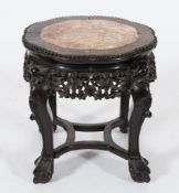 A Chinese carved hardwood circular jardiniere stand: the lobed top with a beaded edge,