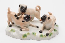 A Meissen porcelain pug group: modelled after J.J.