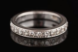 A diamond mounted twelve-stone half-eternity ring: with circular brilliant-cut diamonds estimated