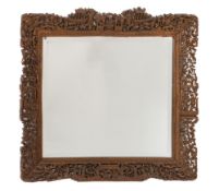A Chinese carved wood rectangular mirror:, with inset bevelled plate,