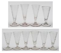Ten English ale glasses: comprising six dwarf ales of wrythen moulded form on rudimentary stem and