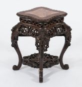 A Chinese carved hardwood jardiniere stand:, of navette shaped outline,
