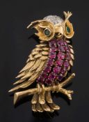 A ruby, diamond and emerald mounted 'perched owl' brooch: with emerald-set eyes,