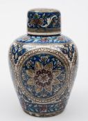 A Qajar jar and cover: of oviform decorated in blue, yellow,