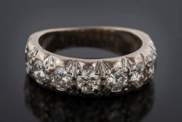 A diamond mounted eight-stone half-eternity ring: the circular brilliant-cut diamonds estimated to