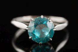 A blue zircon single-stone ring: the circular blue zircon approximately 8.9mm diameter x 5.